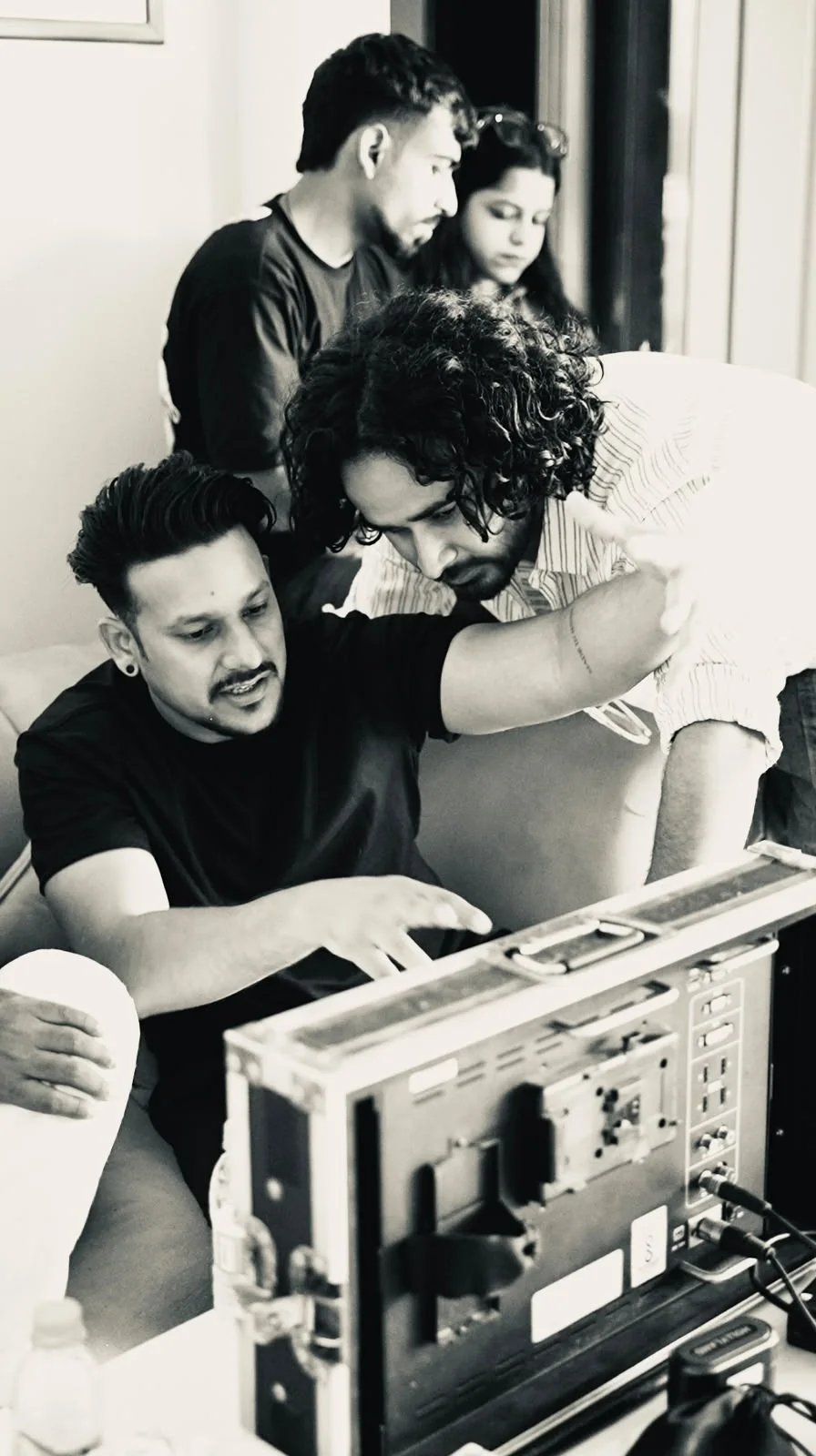 Two of the crew watching the monitor together