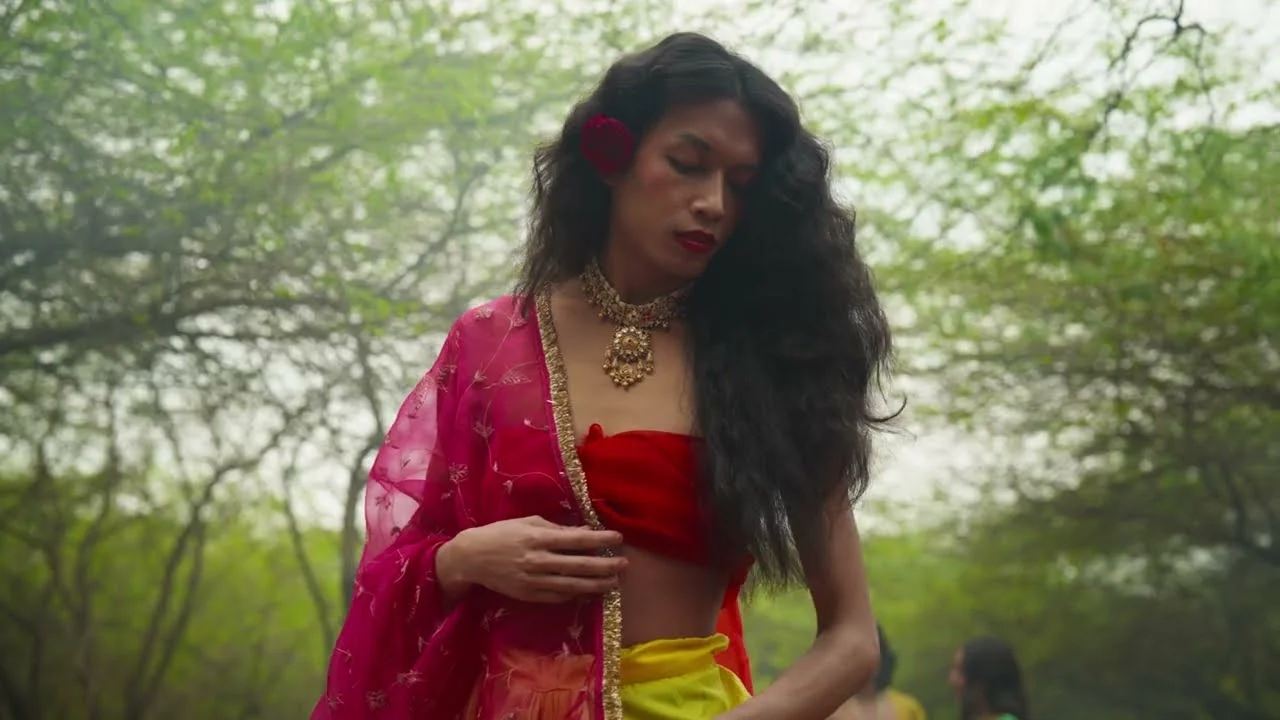 Woman in a pink dupatta among the trees