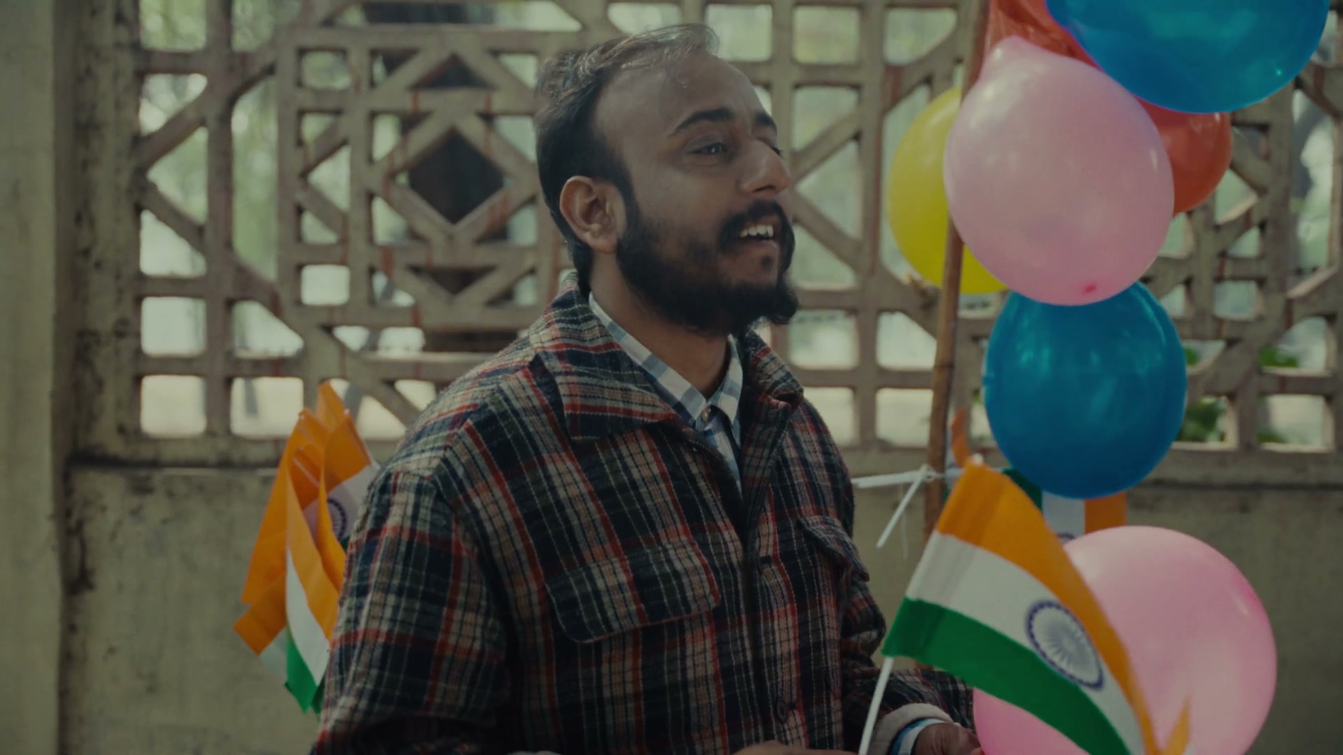Balloon seller with flags and balloons