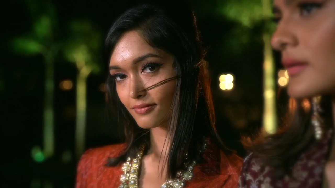 Close-up of a model under the night lights