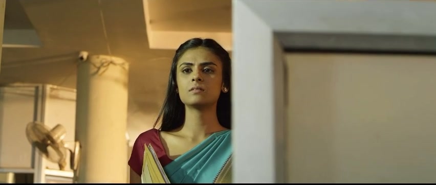 Woman in a sari standing in the office