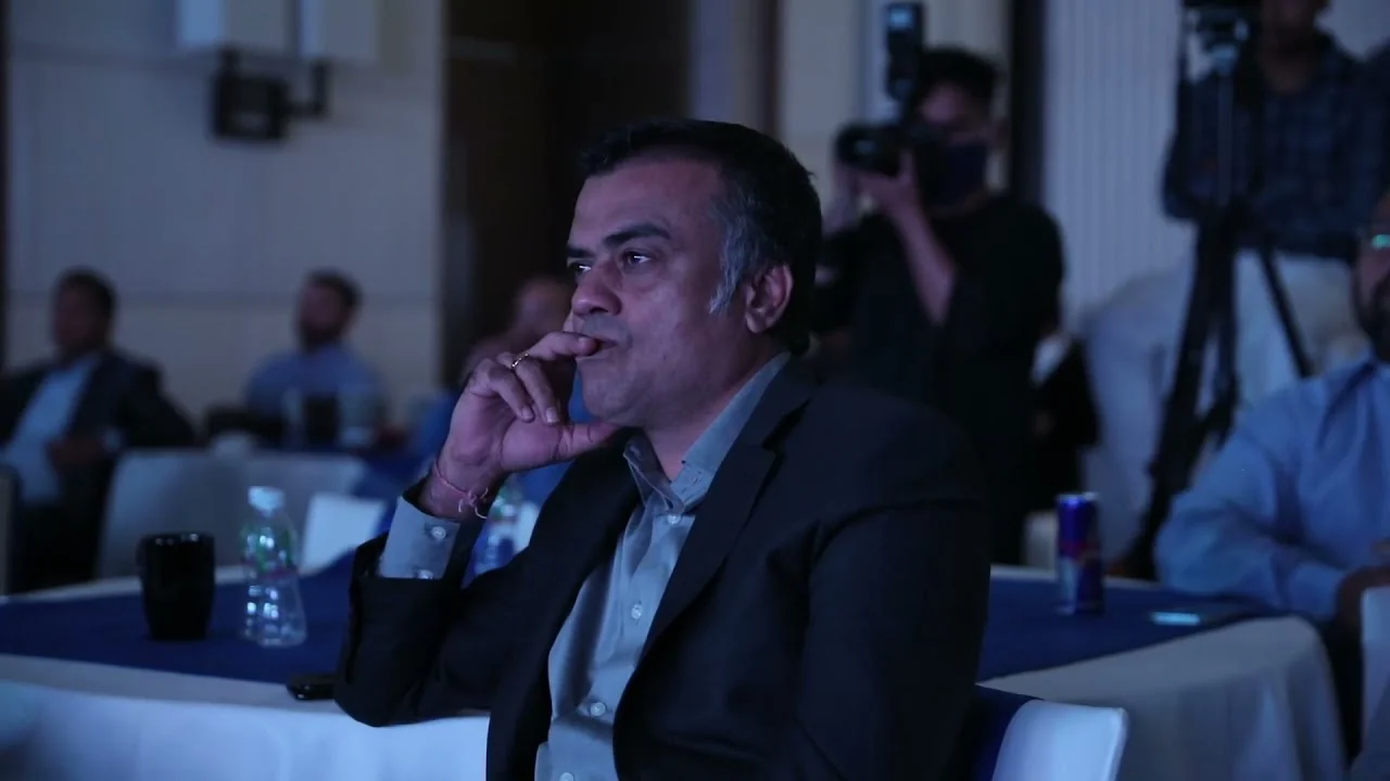 A guest listening, chin in hand